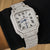 Platonic AUREVIAN automatic luxury square wristwatch with pavé-set stones on a stainless steel case and bracelet.