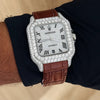 Platonic Aurevian automatic watch with a stone-encrusted square case, silver dial, and brown alligator leather strap.