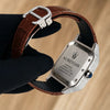 Platonic AUREVIAN automatic watch with stone-set square case, brown alligator-embossed leather strap, and steel clasp.